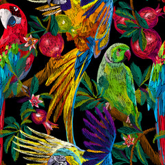 Tropical background. Exotic birds and fruits on the branches. Pomegranate tree and parrots. Colorful animals seamless pattern. Embroidery texture. Fashion design for textile, fabric and wallpaper.