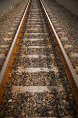 Fototapeta premium Train tracks, railroad tracks on gravel type ballast or kricak.