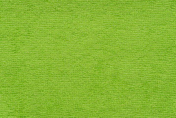 Texture of green microfiber fabric. Microfibre cloths background.