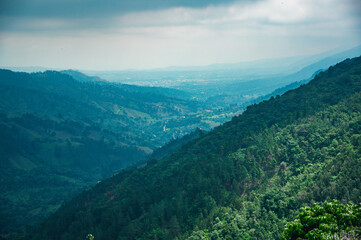 Mountains hill during rain panorama look. Pick view on tropical forest land
