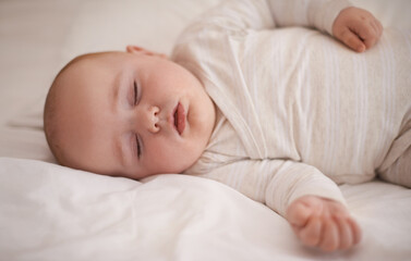 Hes out for the count. Cropped shot of an adorable baby boy asleep.