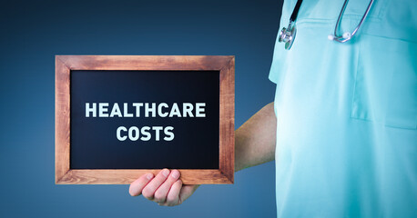 Healthcare costs. Doctor shows sign/board with wooden frame. Background blue