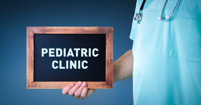 Pediatric Clinic. Doctor shows sign/board with wooden frame. Background blue
