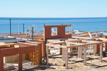 Construction of home over looking blue Pacific ocean in Malibu California