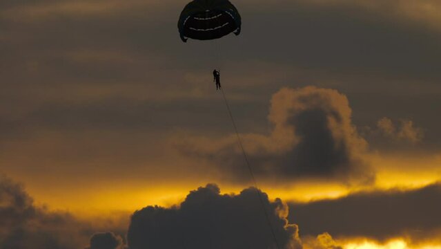 Parachute in the sunset sky