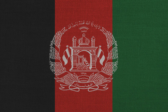 Patriotic textile background in colors of national flag. Afghanistan