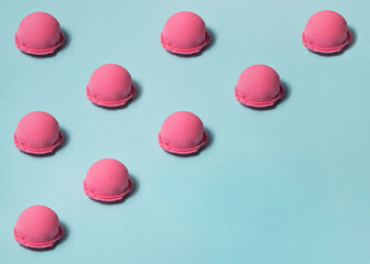 Pastel light pink ice cream balls on blue background. Creative food concept. Minimalistic sweets composition with copy space.