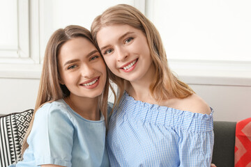 Young sisters spending time together at home