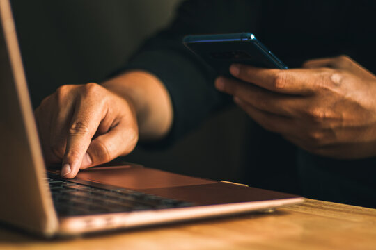 businessman hand holding phone for paying online and shopping on global network, online banking and digital marketing.