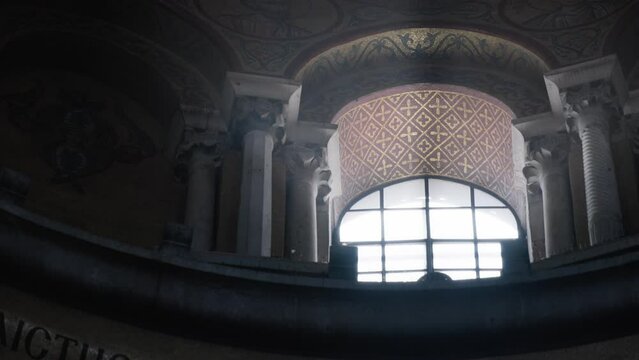 Light rays coming into the church interior through the high window. Slow motion. 