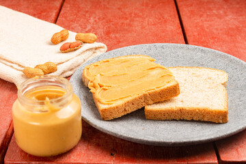 Peanut butter sandwich on a wooden table