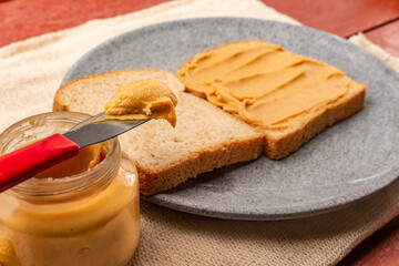 Peanut butter sandwich on a wooden table