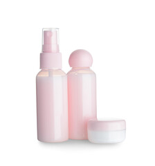 Travel bottles and jar with cosmetic products on white background