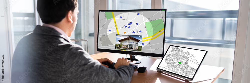 Poster businessperson analyzing cadastre map on computer