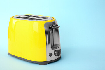 New modern toaster on blue background