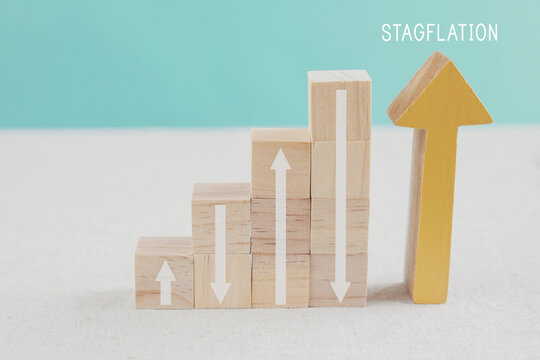 arrows up and down on wooden blocks ladder, Rising and inclining arrows, financial crisis, Stagflation concept