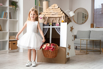 Adorable little girl playing at home