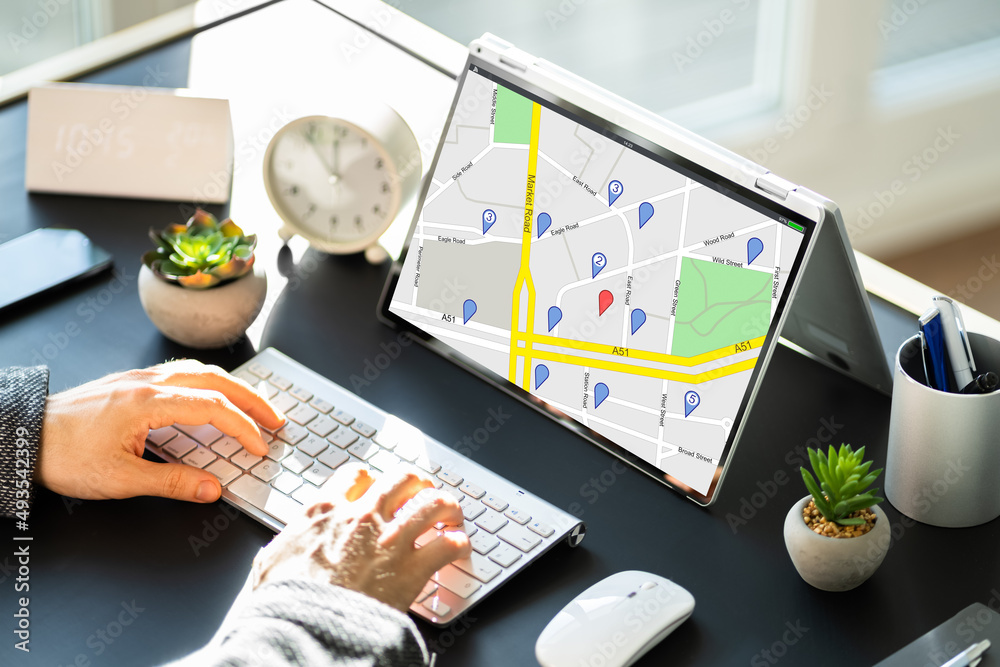 Wall mural man using gps map with navigation pointers