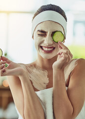 Its both cooling and purifying for my skin. Shot of an attractive young woman holding cucumber...