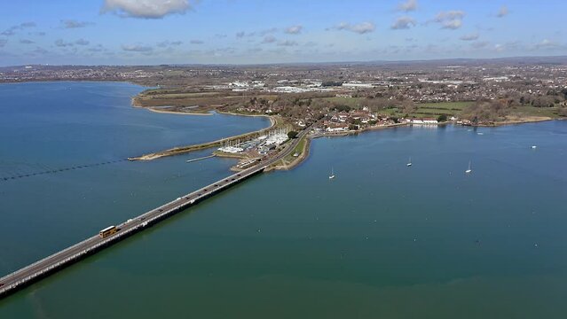 Langstone Bridge over Langstone Harbour towards the Sailing Club on the waterfront of the harbour, Aerial.