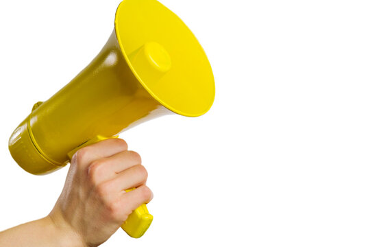 On a white background, a yellow megaphone in a man's hand. Minimalism. There is an empty space to insert. Elections, negotiations, fakes, rumors, notifications, rallies.