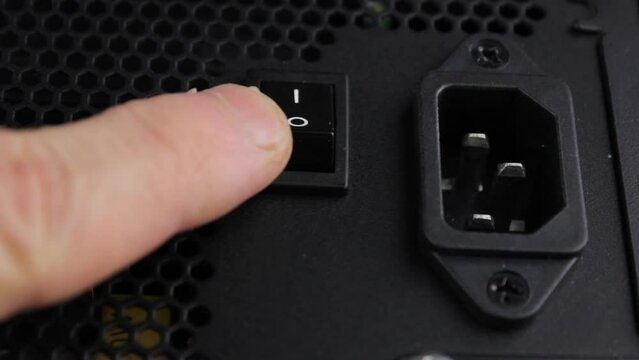 Black button to turn on off on the computer. Start button. Button on the power supply.