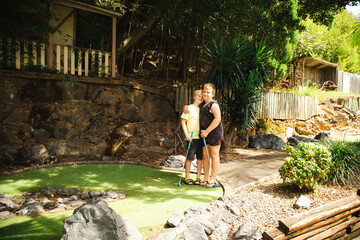 Kids playing mini golf at the Big Banana fun park, Coffs Harbour Australia