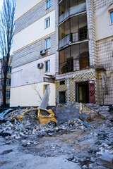 Naklejka premium Damaged multi-storey building in Kyiv, the consequences of Russian missile attacks in the capital of Ukraine. War and aggression of Russia against Ukraine.