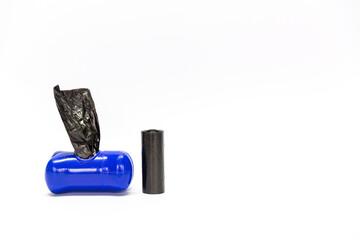 Blue container for dog bags and to collect their poop and next to it a spare black bag