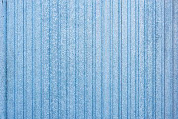 White and blue corrugated metal background.