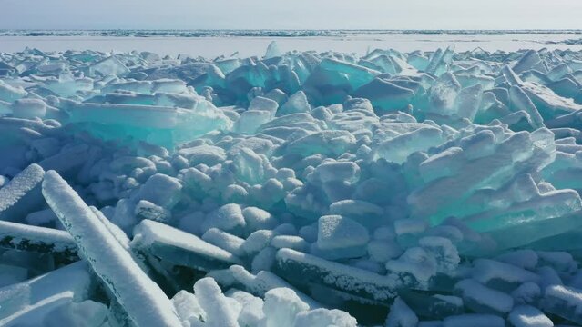 Aerial view of huge ridge of ice hummocks on Lake Baikal, Russia, 4k