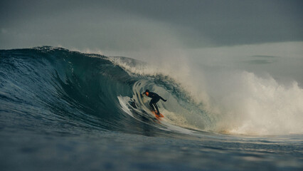 surfer getting tubed