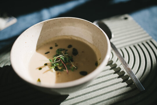 Simple bowl of fine cream soup on a table