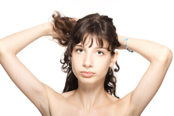 Fototapeta premium Beautiful young girl studio portrait. Looking at camera.