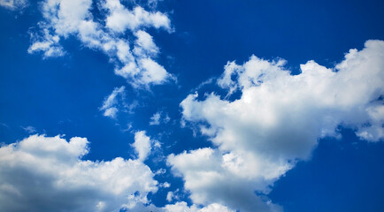 Obraz na płótnie Canvas Bright Blue Sky and Puffy Clouds