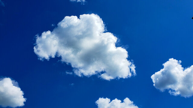 Blue Sky With White, Puffy Cloud