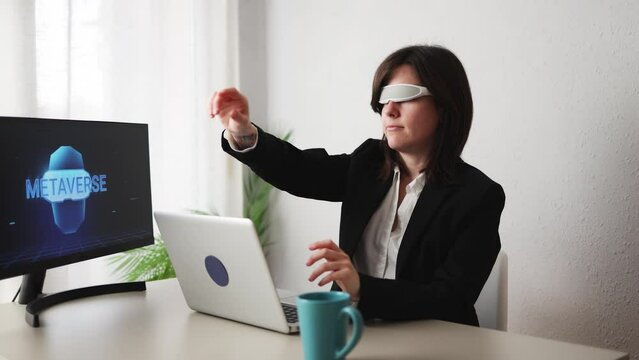 Business woman working with augmented reality goggles - Metaverse technology concept