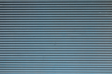 Pale blue steel corrugated background.