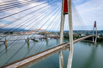 Famous Sky Train Bridge over the water, a cable-suspended bridge spanning across Fraser River, British Columbia, Canada.