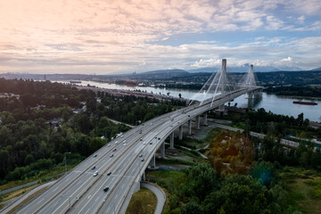 Famous Port Mann Bridge over the water, a cable-suspended bridge spanning across Fraser River,...