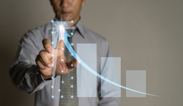 The fing touch screen of planning and strategy, Stock market, Business Development and growth, progress or success concept. Businessmen plan growth and increase of positive indicators in his business.