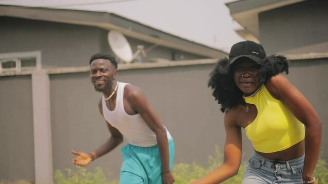 boy and girl doing Nigerian dance routine