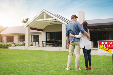 And its all ours. Shot of a young couple admiring their newly purchased house. - obrazy, fototapety, plakaty