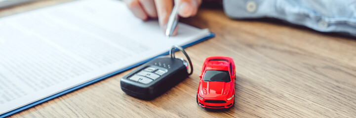 Sale agent deal to agreement successful car loan contract with customer and sign agreement contract...