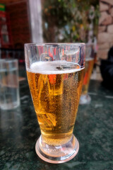 a glass of beer on the table, alcohol