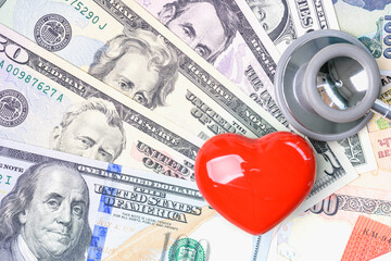 Cardiac care and heart health insurance, healthcare concept : Red heart and a stethoscope on US...