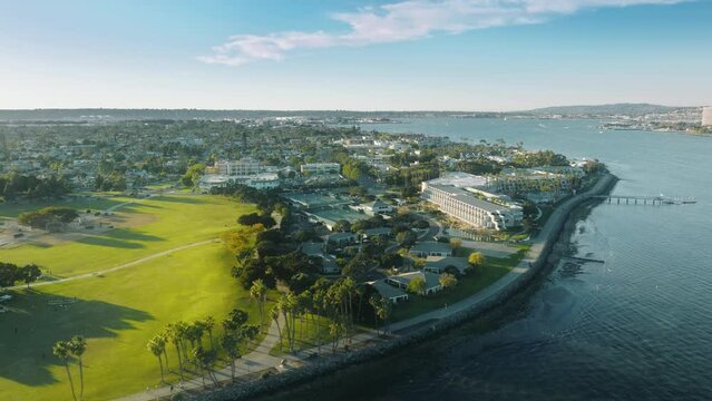 Scenic drone aerial over Coronado island with golf course and water front hotels