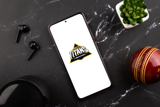 West Bangal, India - March 18, 2022 : Gujarat Titans logo on phone screen stock image.