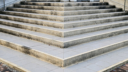 Modern architecture detail. Grunge texture of outdoor staircase. Step of rock stair with vintage...