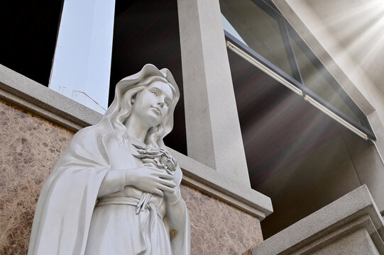 Close-up of Statue of Our lady of grace virgin Mary located in front of the church with natural background, Thailand. selective focus.